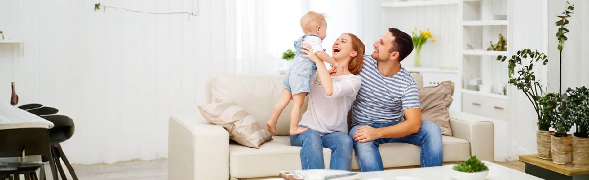 Family relaxing in a living room, where hidden mold may affect health, especially for young children